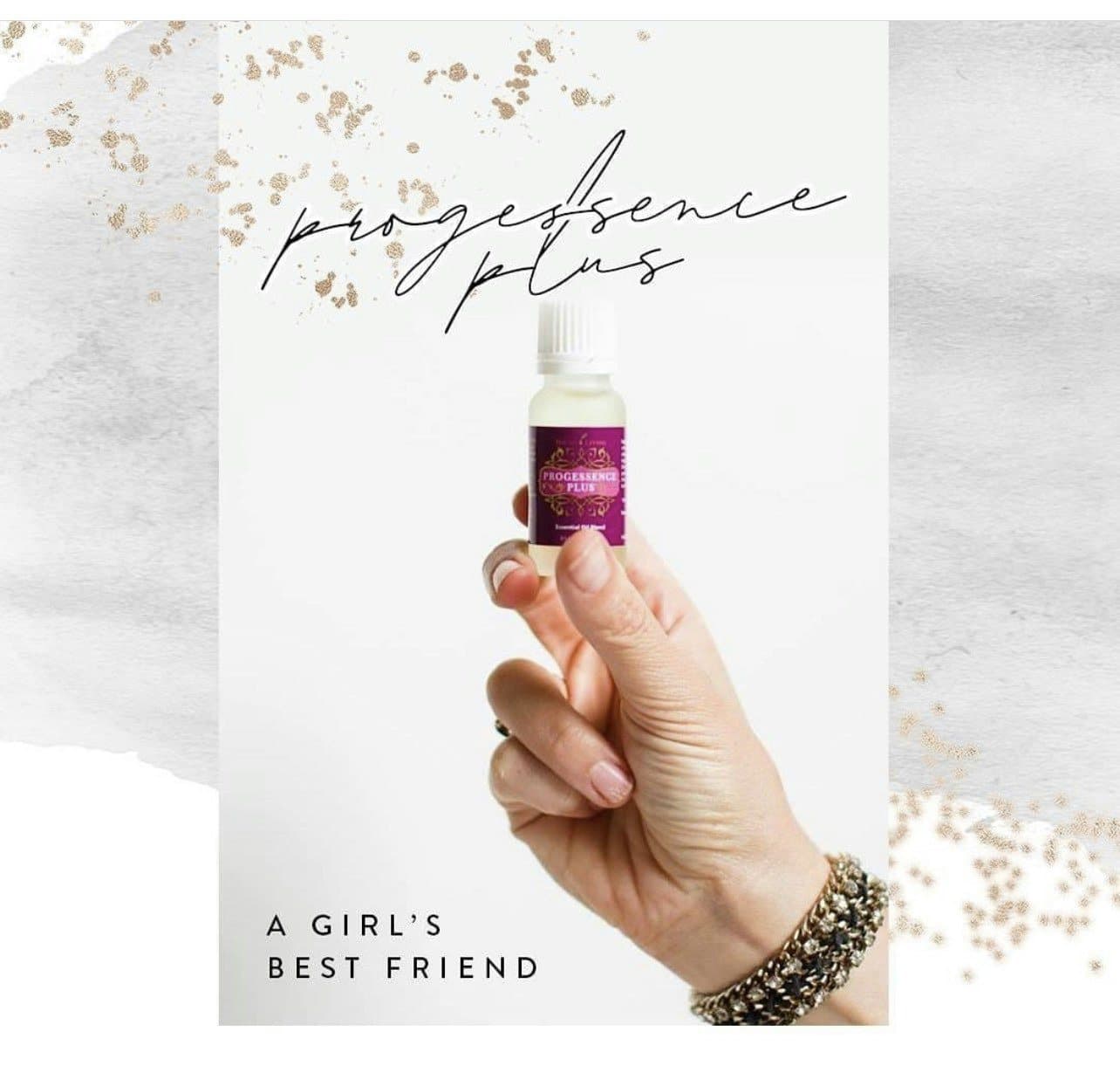 Young Living essential oil bottle held in hand